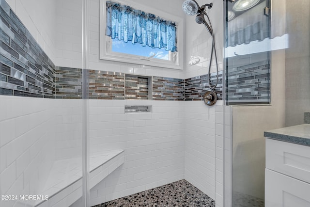 bathroom featuring an enclosed shower and vanity