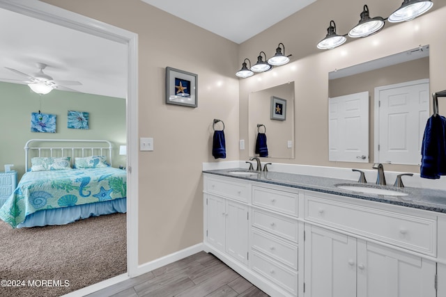 bathroom with ceiling fan and vanity