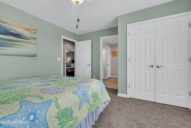 bedroom featuring ceiling fan, a closet, and carpet flooring