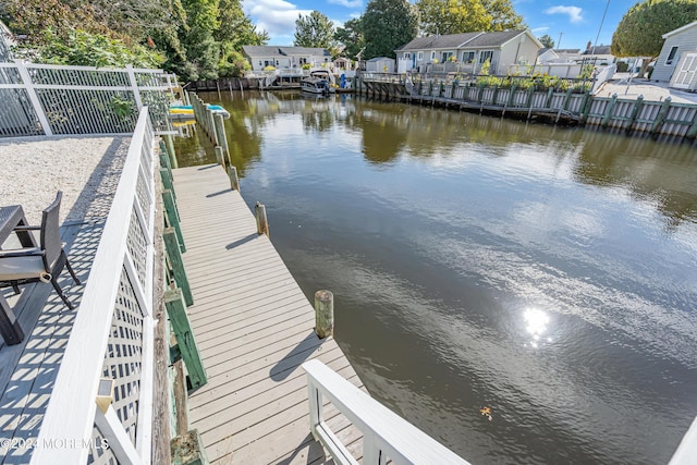 dock area with a water view