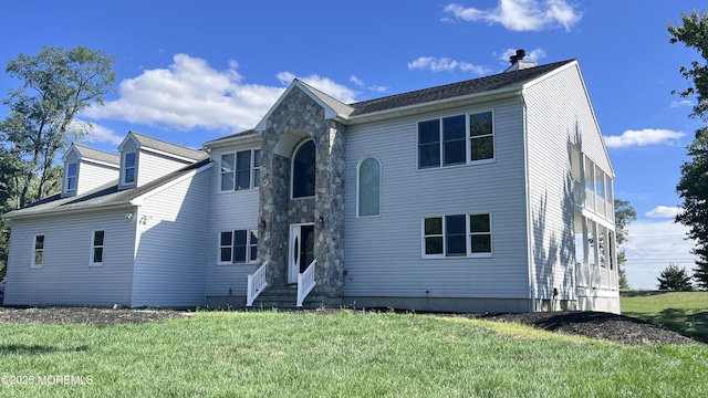 view of front of property with a front lawn