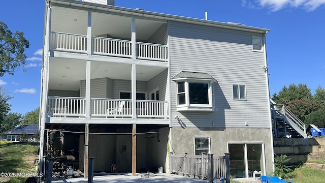 rear view of house featuring a balcony