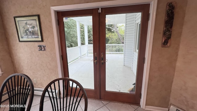 doorway featuring light tile patterned floors and french doors