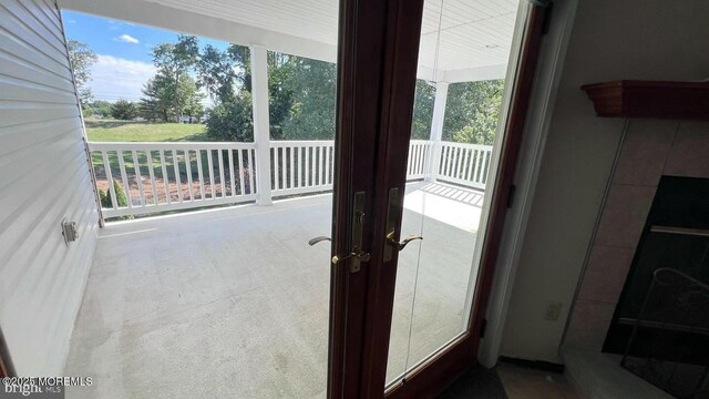 doorway with carpet floors