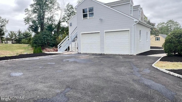 view of side of property with a garage