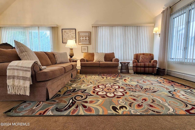 living room with plenty of natural light, a baseboard heating unit, carpet flooring, and vaulted ceiling