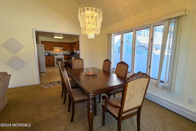 carpeted dining room with baseboard heating and a chandelier