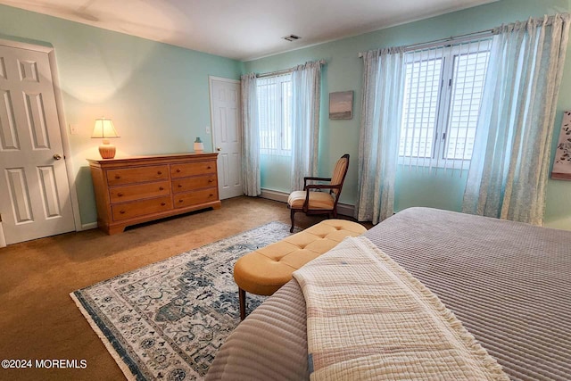 bedroom featuring light colored carpet