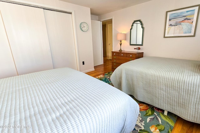 bedroom featuring a closet and hardwood / wood-style flooring