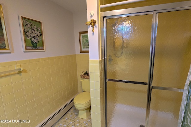 bathroom with toilet, tile walls, tile patterned flooring, a baseboard heating unit, and a shower with door