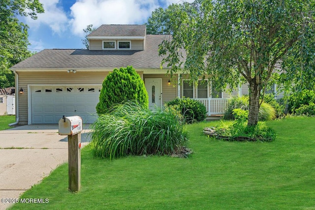 view of front facade with a front yard, a garage, and a porch