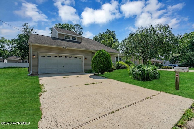 view of front of house featuring a garage and a front yard