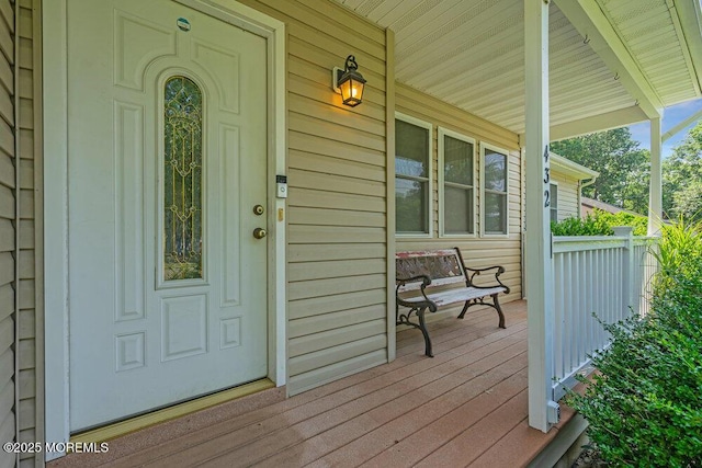 entrance to property featuring a porch