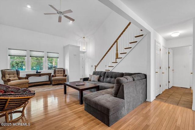 living room featuring ceiling fan and wood-type flooring