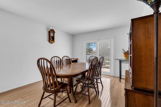 dining area featuring light wood-type flooring