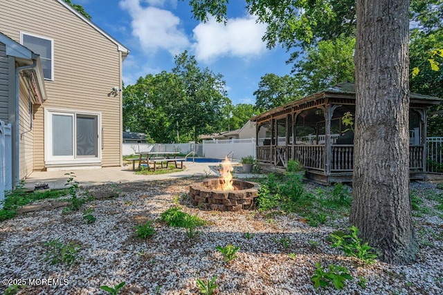 view of yard with a patio area, a gazebo, and a fire pit