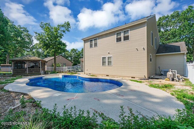 view of swimming pool featuring a gazebo and cooling unit