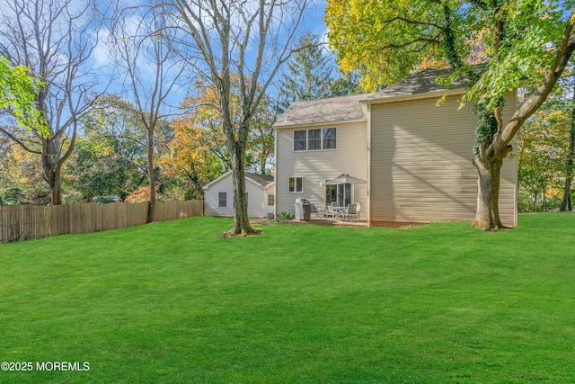 back of property featuring a yard