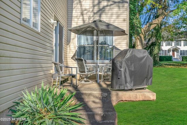 view of patio featuring a grill