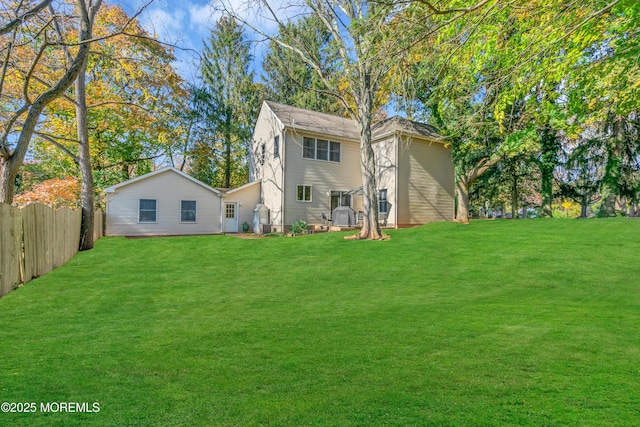 back of house featuring a yard