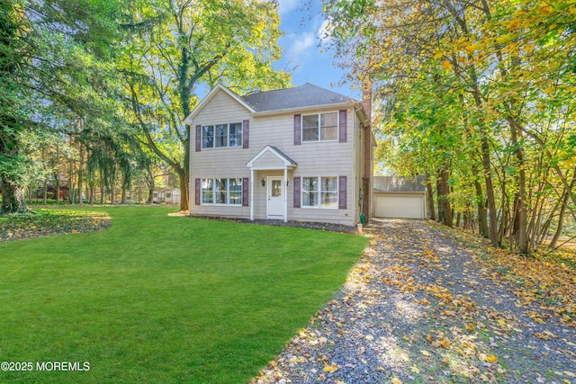 view of front of home featuring a front lawn and a garage