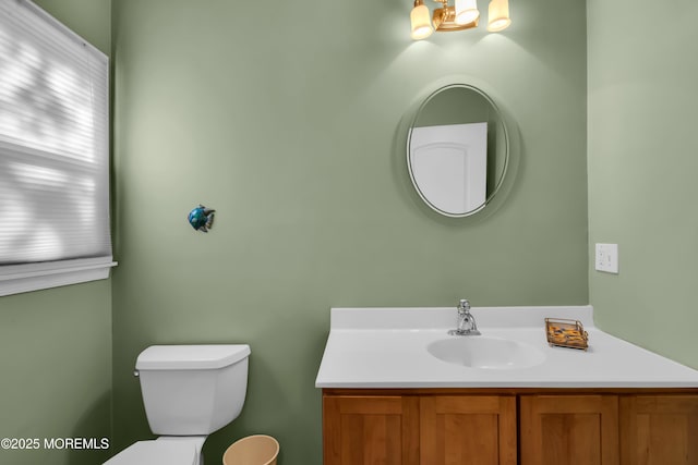 bathroom with toilet and vanity