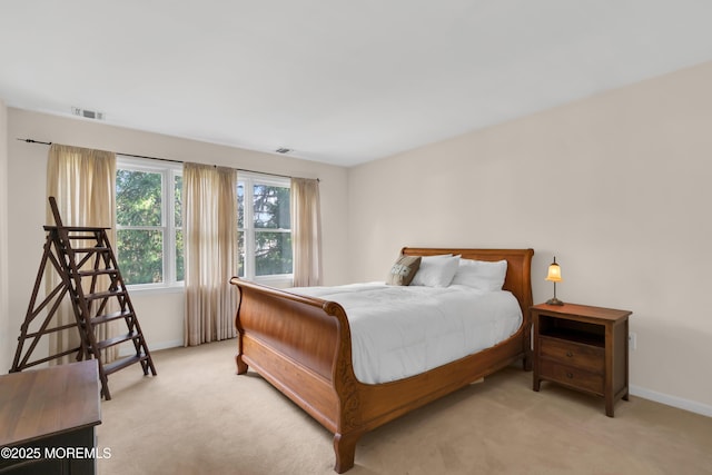 bedroom with light colored carpet