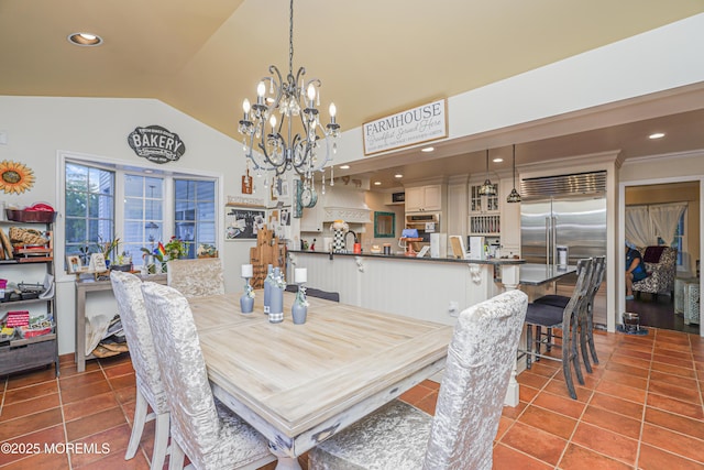 tiled dining room with lofted ceiling and a notable chandelier