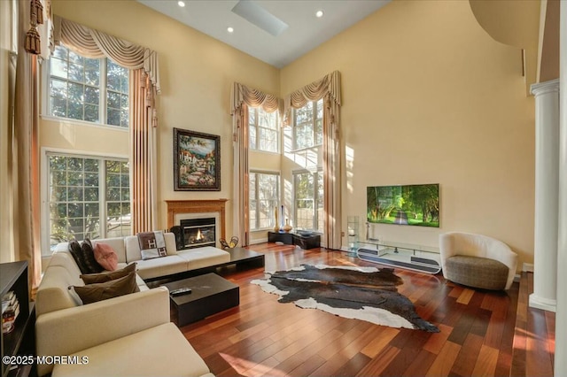 interior space with a high ceiling and wood-type flooring