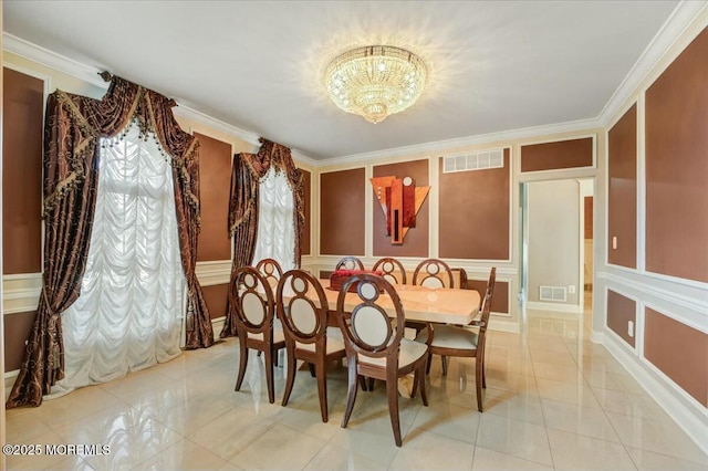 dining space featuring light tile patterned floors and crown molding