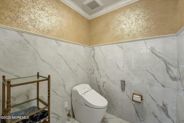 bathroom featuring toilet and crown molding