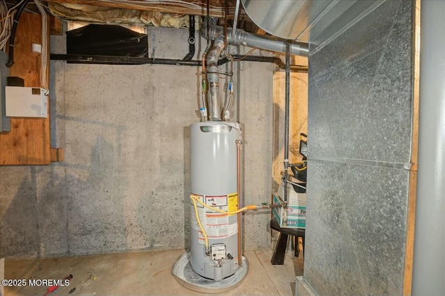 utility room featuring gas water heater