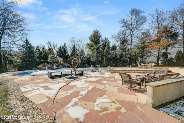 view of patio featuring a covered pool