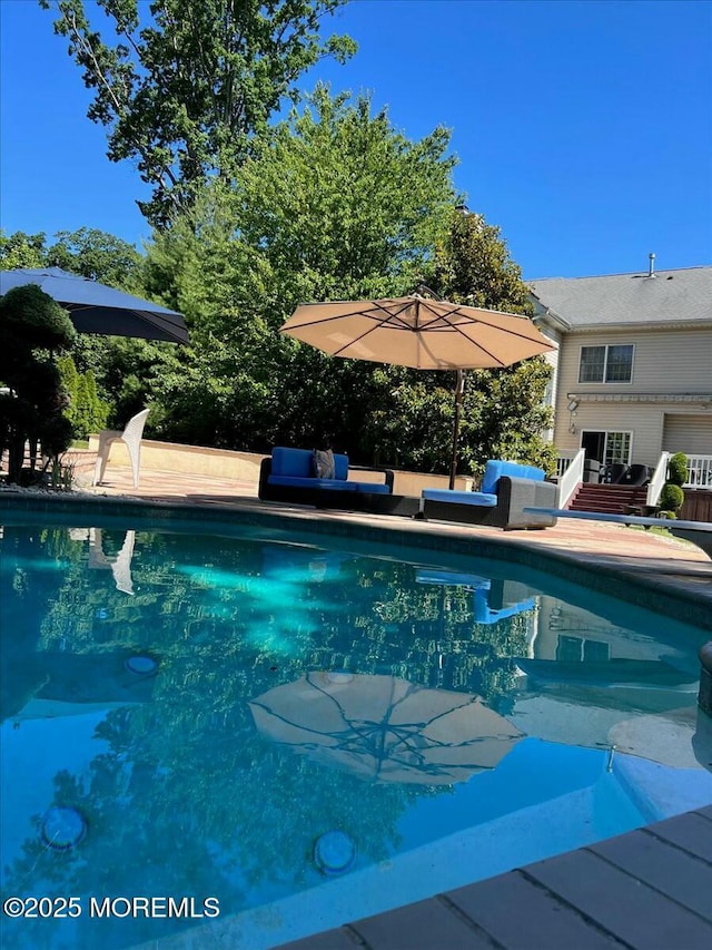 view of pool with an outdoor hangout area