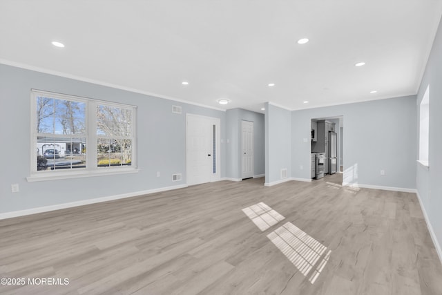 unfurnished living room with crown molding and light wood-type flooring