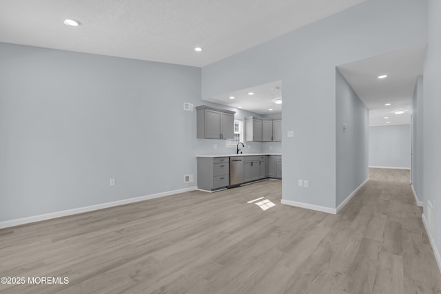 interior space with sink and light wood-type flooring