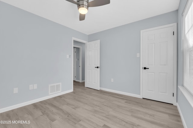 unfurnished bedroom featuring light hardwood / wood-style floors and ceiling fan