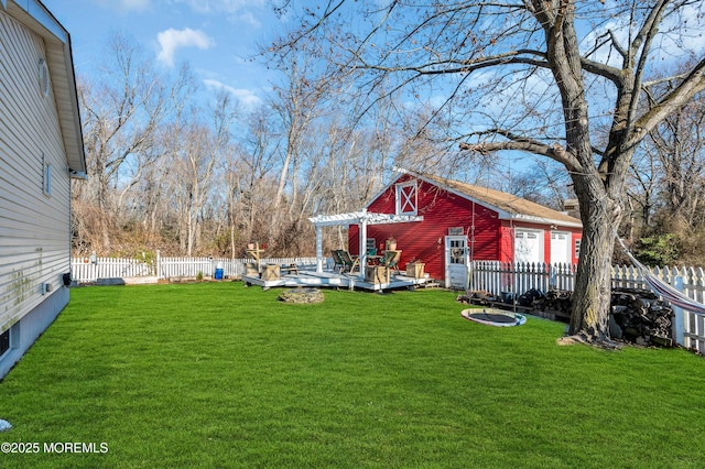 view of yard with a deck, an outdoor structure, and a pergola