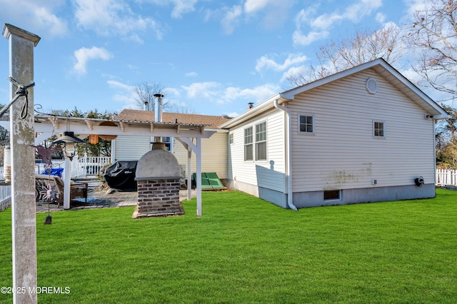 back of house featuring a yard