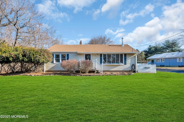 ranch-style home with a front yard