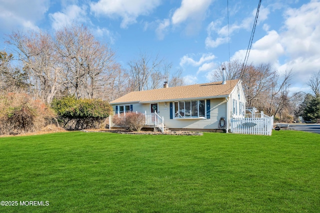 ranch-style house with a front lawn