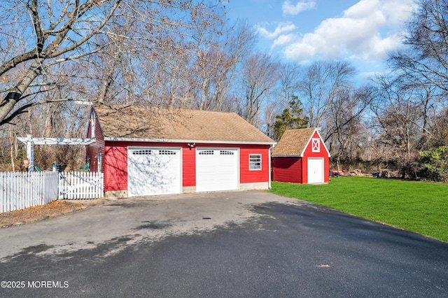 garage featuring a yard