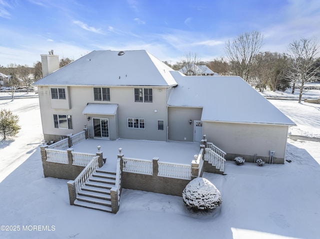 view of snow covered property