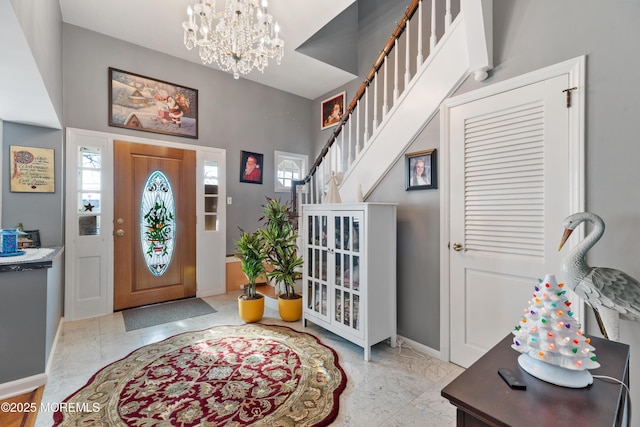 entryway featuring a chandelier