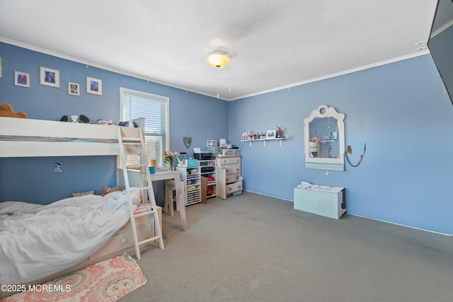 bedroom with ornamental molding and carpet floors