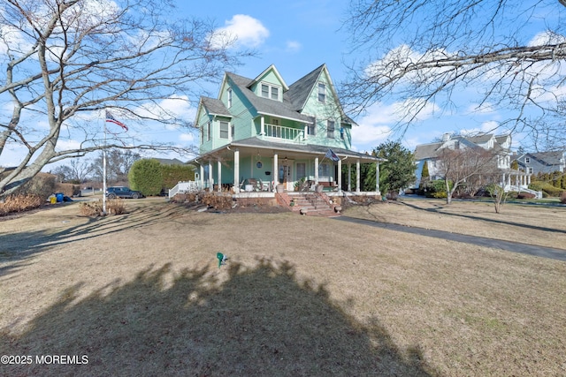 view of front of property featuring a front lawn and covered porch