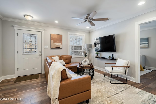 living room with ceiling fan, ornamental molding, and dark hardwood / wood-style floors