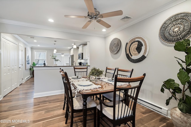 dining room with crown molding, ceiling fan, and dark hardwood / wood-style flooring