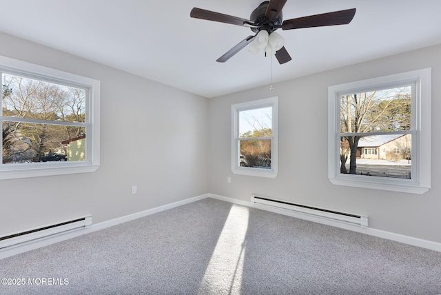 carpeted spare room featuring ceiling fan and a baseboard radiator