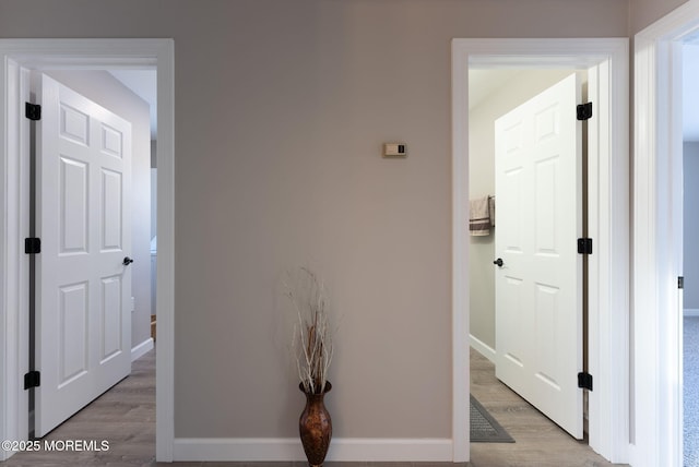 hallway with light wood-type flooring